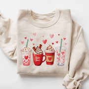 Sand beige pullover sweatshirt with a cute row of coffee cups and heart decorations.