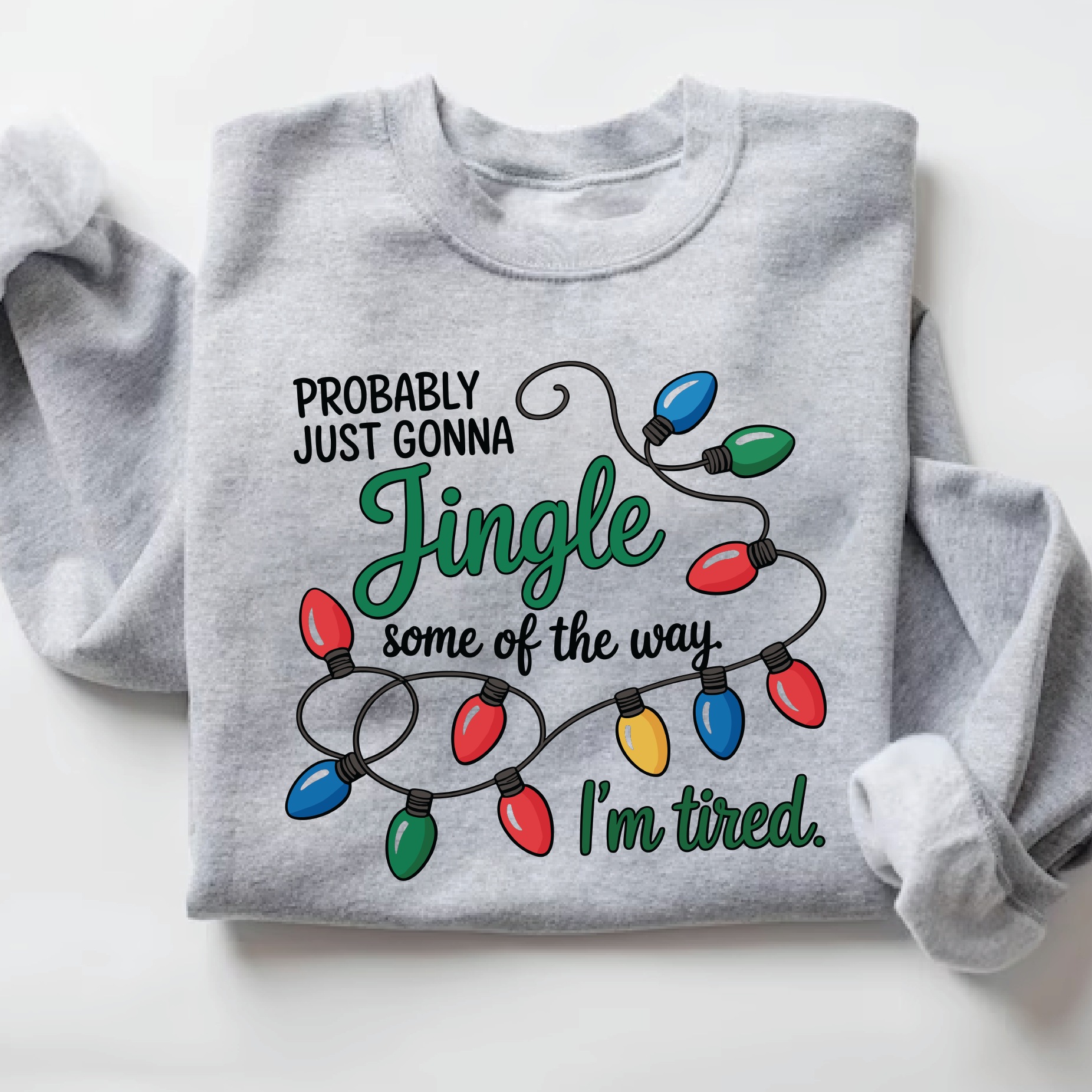 Funny Christmas sweatshirt with colorful Christmas lights and the quote “Probably Just Gonna Jingle Some of the Way, I’m Tired”