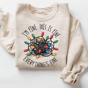 Funny Christmas sweatshirt with tangled lights and “I’m Fine Everything’s Fine” quote on a cozy winter unisex pullover.