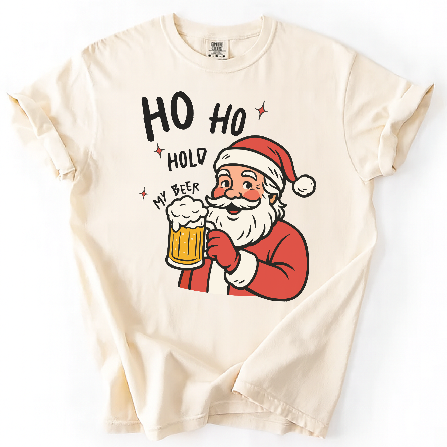 Ivory shirt featuring Santa Claus holding a beer mug with “Ho Ho Hold My Beer” text