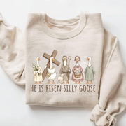 Shop the viral He Is Risen Silly Goose Sweatshirt! A funny, cute, and meaningful Christian crewneck perfect for Easter Sunday. High-quality print, soft fabric.
